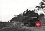 Image of Americans rescued from Japanese prison camp ride in trucks Guimba Nueva Ecija Philippines, 1945, second 3 stock footage video 65675062322