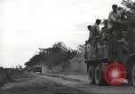 Image of Americans rescued from Japanese prison camp ride in trucks Guimba Nueva Ecija Philippines, 1945, second 5 stock footage video 65675062322