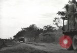 Image of Americans rescued from Japanese prison camp ride in trucks Guimba Nueva Ecija Philippines, 1945, second 6 stock footage video 65675062322