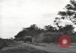 Image of Americans rescued from Japanese prison camp ride in trucks Guimba Nueva Ecija Philippines, 1945, second 9 stock footage video 65675062322
