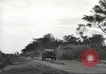 Image of Americans rescued from Japanese prison camp ride in trucks Guimba Nueva Ecija Philippines, 1945, second 11 stock footage video 65675062322
