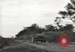 Image of Americans rescued from Japanese prison camp ride in trucks Guimba Nueva Ecija Philippines, 1945, second 12 stock footage video 65675062322