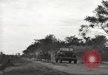 Image of Americans rescued from Japanese prison camp ride in trucks Guimba Nueva Ecija Philippines, 1945, second 13 stock footage video 65675062322