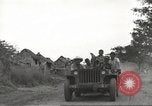 Image of Americans rescued from Japanese prison camp ride in trucks Guimba Nueva Ecija Philippines, 1945, second 15 stock footage video 65675062322