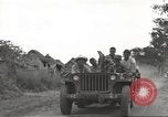 Image of Americans rescued from Japanese prison camp ride in trucks Guimba Nueva Ecija Philippines, 1945, second 16 stock footage video 65675062322