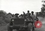 Image of Americans rescued from Japanese prison camp ride in trucks Guimba Nueva Ecija Philippines, 1945, second 17 stock footage video 65675062322