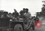 Image of Americans rescued from Japanese prison camp ride in trucks Guimba Nueva Ecija Philippines, 1945, second 18 stock footage video 65675062322