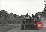 Image of Americans rescued from Japanese prison camp ride in trucks Guimba Nueva Ecija Philippines, 1945, second 21 stock footage video 65675062322
