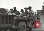 Image of Americans rescued from Japanese prison camp ride in trucks Guimba Nueva Ecija Philippines, 1945, second 23 stock footage video 65675062322