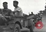 Image of Americans rescued from Japanese prison camp ride in trucks Guimba Nueva Ecija Philippines, 1945, second 24 stock footage video 65675062322