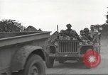 Image of Americans rescued from Japanese prison camp ride in trucks Guimba Nueva Ecija Philippines, 1945, second 25 stock footage video 65675062322