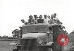 Image of Americans rescued from Japanese prison camp ride in trucks Guimba Nueva Ecija Philippines, 1945, second 40 stock footage video 65675062322
