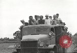 Image of Americans rescued from Japanese prison camp ride in trucks Guimba Nueva Ecija Philippines, 1945, second 41 stock footage video 65675062322