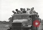 Image of Americans rescued from Japanese prison camp ride in trucks Guimba Nueva Ecija Philippines, 1945, second 43 stock footage video 65675062322