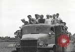 Image of Americans rescued from Japanese prison camp ride in trucks Guimba Nueva Ecija Philippines, 1945, second 44 stock footage video 65675062322