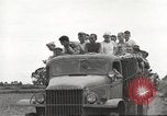 Image of Americans rescued from Japanese prison camp ride in trucks Guimba Nueva Ecija Philippines, 1945, second 45 stock footage video 65675062322
