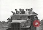 Image of Americans rescued from Japanese prison camp ride in trucks Guimba Nueva Ecija Philippines, 1945, second 46 stock footage video 65675062322