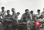 Image of Americans rescued from Japanese prison camp ride in trucks Guimba Nueva Ecija Philippines, 1945, second 47 stock footage video 65675062322