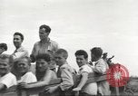 Image of Americans rescued from Japanese prison camp ride in trucks Guimba Nueva Ecija Philippines, 1945, second 49 stock footage video 65675062322