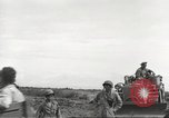 Image of Americans rescued from Japanese prison camp ride in trucks Guimba Nueva Ecija Philippines, 1945, second 50 stock footage video 65675062322