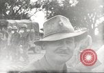Image of Americans rescued from Japanese prison camp ride in trucks Guimba Nueva Ecija Philippines, 1945, second 51 stock footage video 65675062322