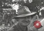 Image of Americans rescued from Japanese prison camp ride in trucks Guimba Nueva Ecija Philippines, 1945, second 53 stock footage video 65675062322