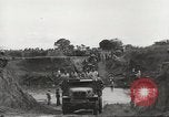 Image of Americans rescued from Japanese prison camp ride in trucks Guimba Nueva Ecija Philippines, 1945, second 57 stock footage video 65675062322