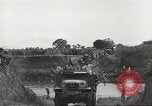Image of Americans rescued from Japanese prison camp ride in trucks Guimba Nueva Ecija Philippines, 1945, second 58 stock footage video 65675062322