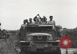 Image of Americans rescued from Japanese prison camp ride in trucks Guimba Nueva Ecija Philippines, 1945, second 62 stock footage video 65675062322