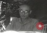 Image of Japanese officials review map Philippines, 1942, second 49 stock footage video 65675062386