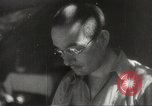 Image of Japanese officials review map Philippines, 1942, second 57 stock footage video 65675062386
