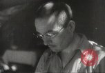 Image of Japanese officials review map Philippines, 1942, second 58 stock footage video 65675062386