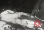 Image of Japanese officials review map Philippines, 1942, second 62 stock footage video 65675062386
