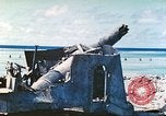 Image of Japanese coastal defense gun Tarawa Gilbert Islands, 1944, second 4 stock footage video 65675062569