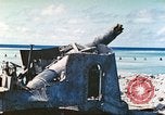 Image of Japanese coastal defense gun Tarawa Gilbert Islands, 1944, second 6 stock footage video 65675062569