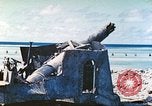 Image of Japanese coastal defense gun Tarawa Gilbert Islands, 1944, second 9 stock footage video 65675062569