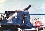 Image of Japanese coastal defense gun Tarawa Gilbert Islands, 1944, second 39 stock footage video 65675062569
