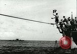 Image of German submarine U-564 reloads torpedo at sea Atlantic Ocean, 1942, second 3 stock footage video 65675062706