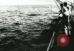 Image of German submarine U-564 reloads torpedo at sea Atlantic Ocean, 1942, second 8 stock footage video 65675062706