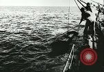 Image of German submarine U-564 reloads torpedo at sea Atlantic Ocean, 1942, second 9 stock footage video 65675062706