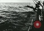 Image of German submarine U-564 reloads torpedo at sea Atlantic Ocean, 1942, second 10 stock footage video 65675062706