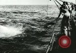 Image of German submarine U-564 reloads torpedo at sea Atlantic Ocean, 1942, second 11 stock footage video 65675062706