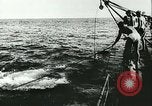 Image of German submarine U-564 reloads torpedo at sea Atlantic Ocean, 1942, second 12 stock footage video 65675062706