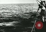 Image of German submarine U-564 reloads torpedo at sea Atlantic Ocean, 1942, second 13 stock footage video 65675062706