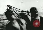 Image of German submarine U-564 reloads torpedo at sea Atlantic Ocean, 1942, second 15 stock footage video 65675062706