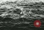 Image of German submarine U-564 reloads torpedo at sea Atlantic Ocean, 1942, second 16 stock footage video 65675062706