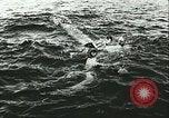 Image of German submarine U-564 reloads torpedo at sea Atlantic Ocean, 1942, second 17 stock footage video 65675062706