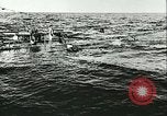 Image of German submarine U-564 reloads torpedo at sea Atlantic Ocean, 1942, second 25 stock footage video 65675062706