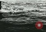 Image of German submarine U-564 reloads torpedo at sea Atlantic Ocean, 1942, second 32 stock footage video 65675062706