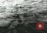 Image of German submarine U-564 reloads torpedo at sea Atlantic Ocean, 1942, second 42 stock footage video 65675062706